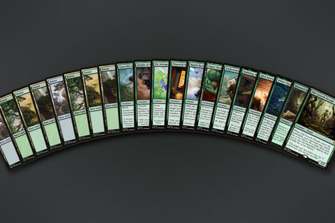 Representative sample of the Green Heroes MTG Repack: 20 cards fanned out, 8 Forests to the rare. Actual cards vary from pack to pack.